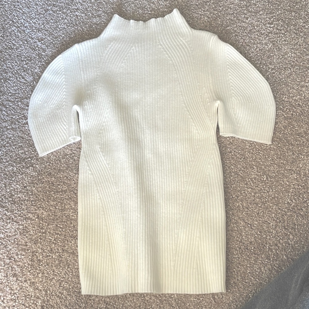 White Anthropologie sweater I bought for an event but didn’t end up wearing.